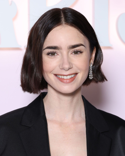 Lily Collins wearing a black blazer